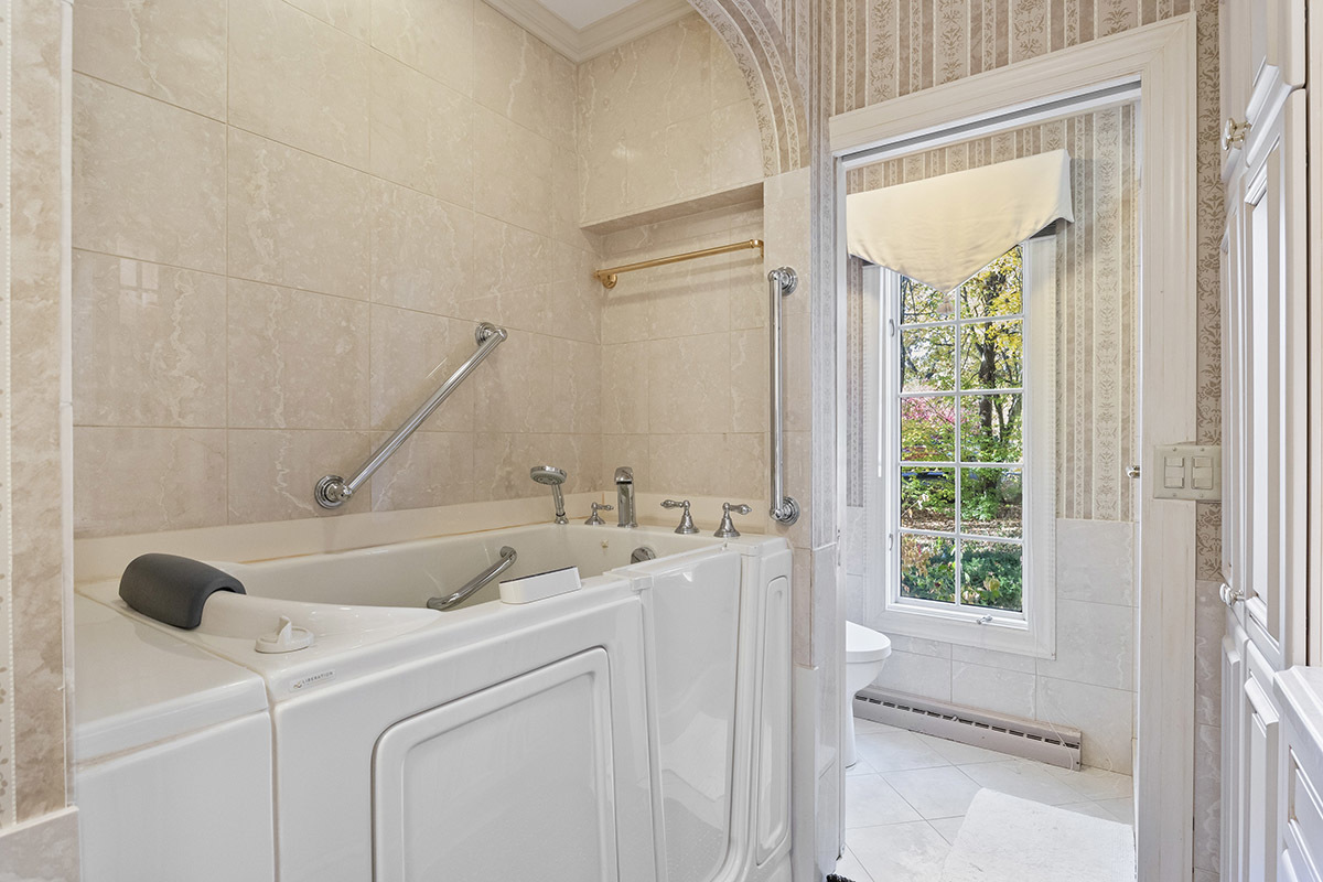 1931 Camphill Circle Inverness, IL 60067 - Photo 21 of 55 a bathroom with a sink and a mirror