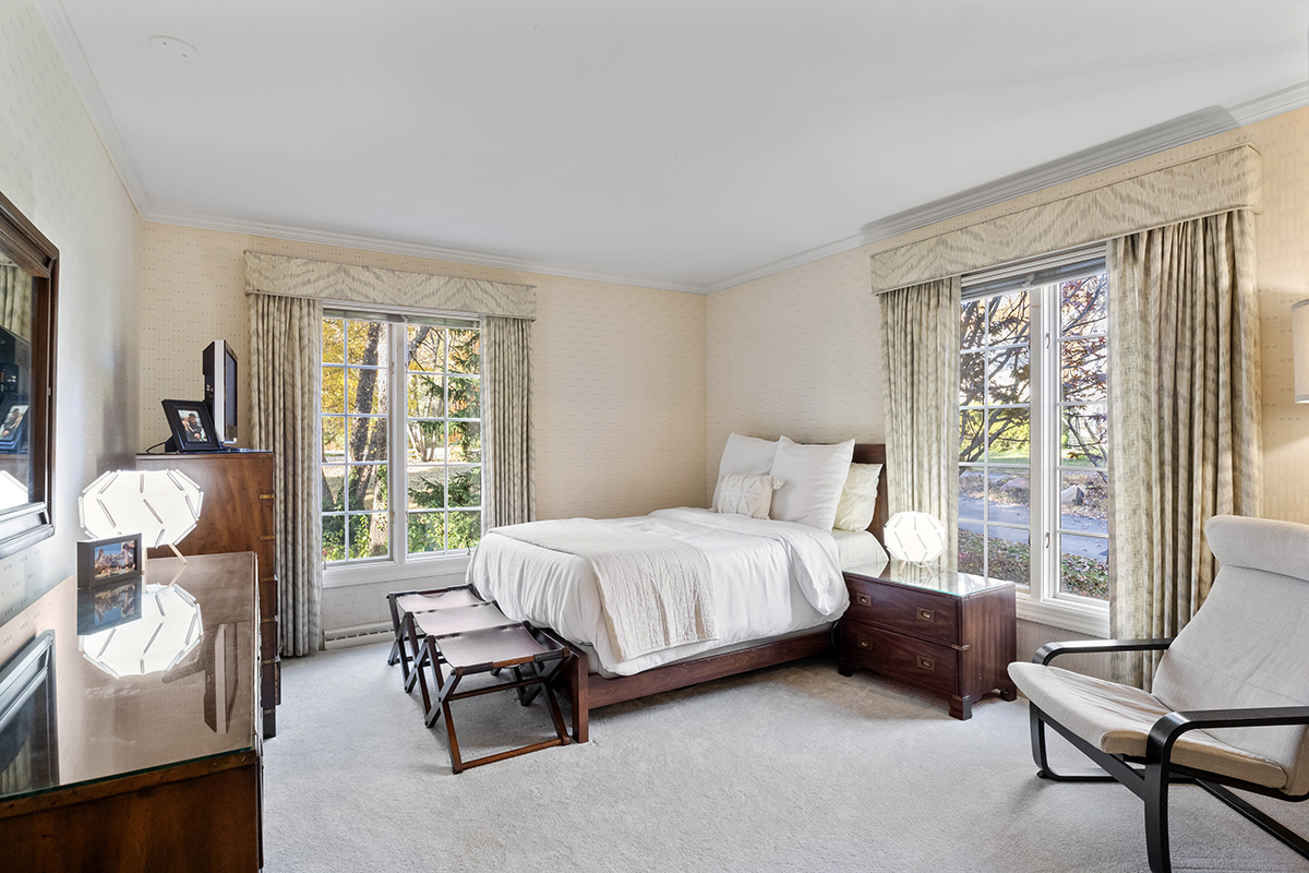 1931 Camphill Circle Inverness, IL 60067 - Photo 22 of 55 a spacious bedroom with a bed and large windows