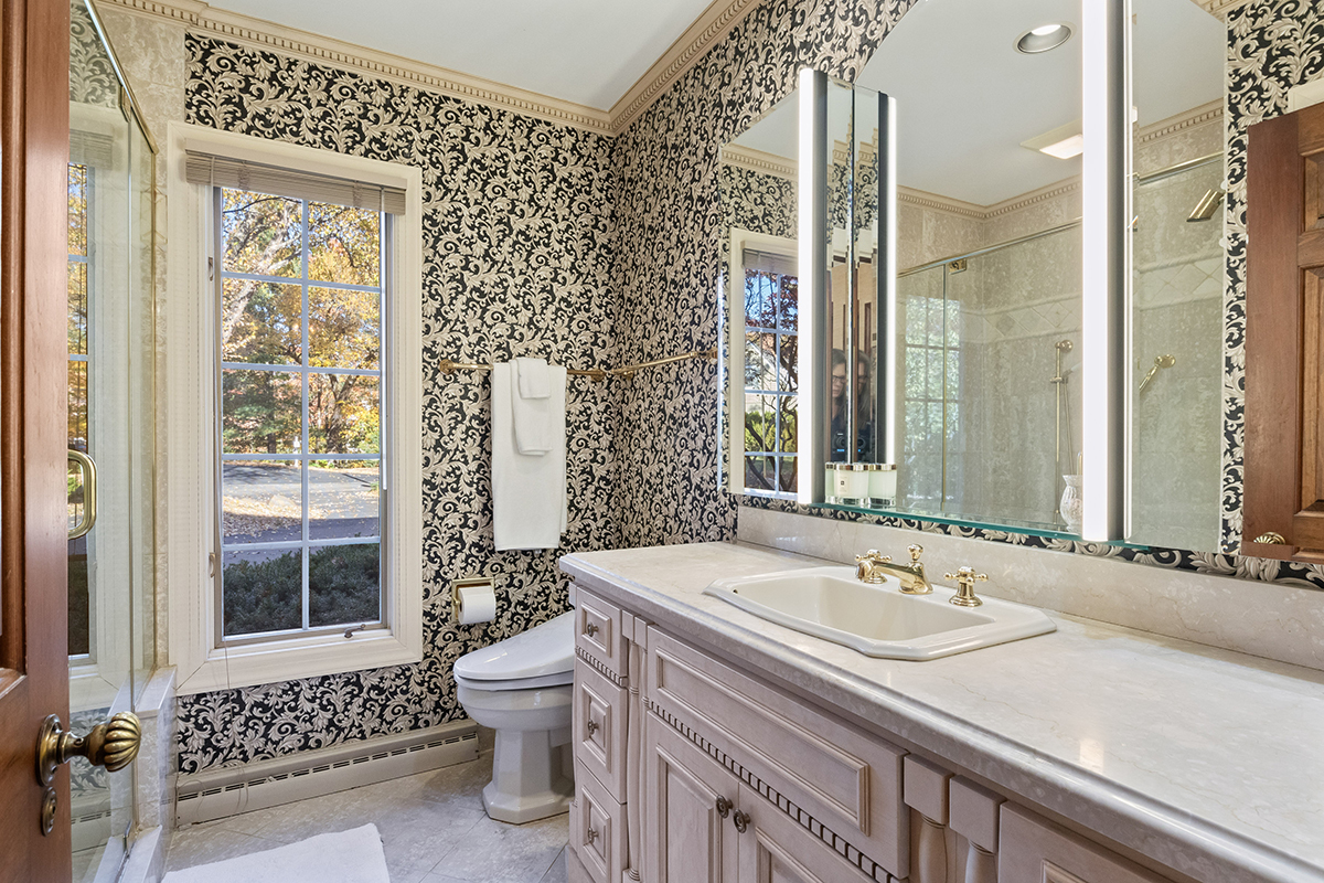 1931 Camphill Circle Inverness, IL 60067 - Photo 24 of 55 a bathroom with a sink toilet and shower