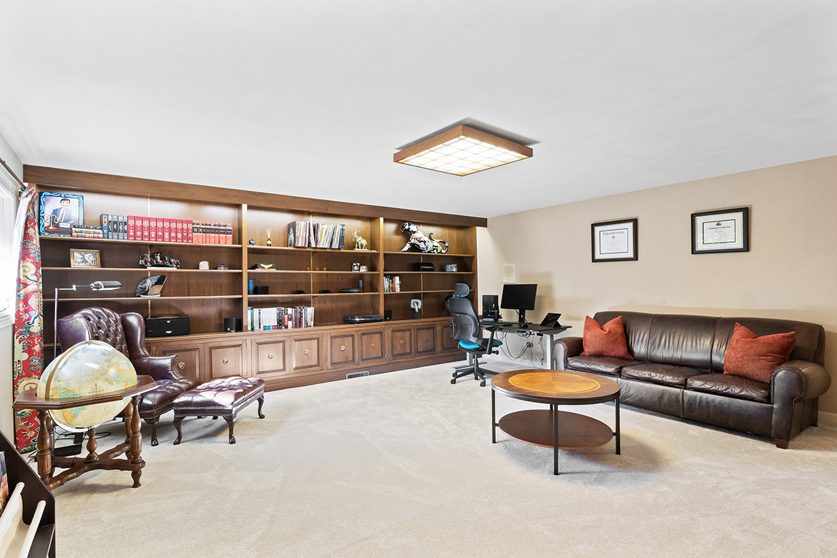1931 Camphill Circle Inverness, IL 60067 - Photo 33 of 55 a living room with a couch and a table