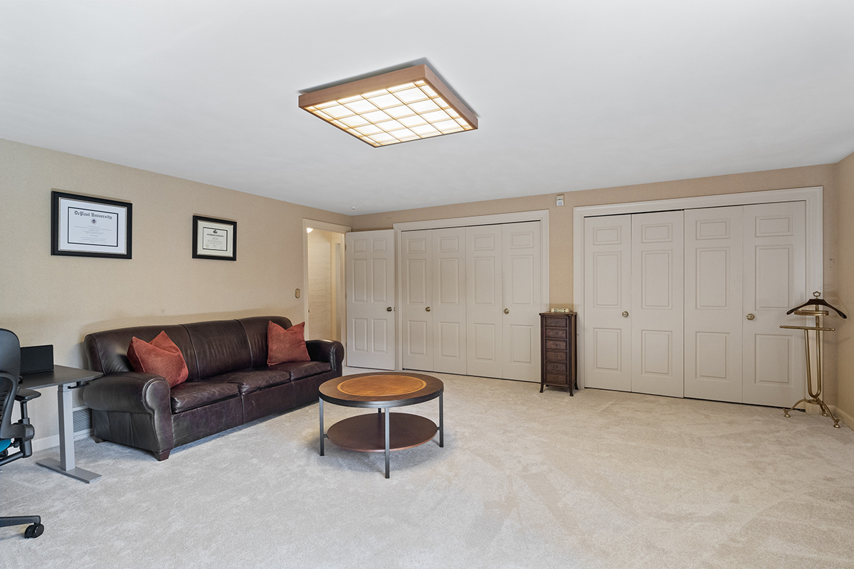 1931 Camphill Circle Inverness, IL 60067 - Photo 34 of 55 a living room with furniture a ceiling fan and a window