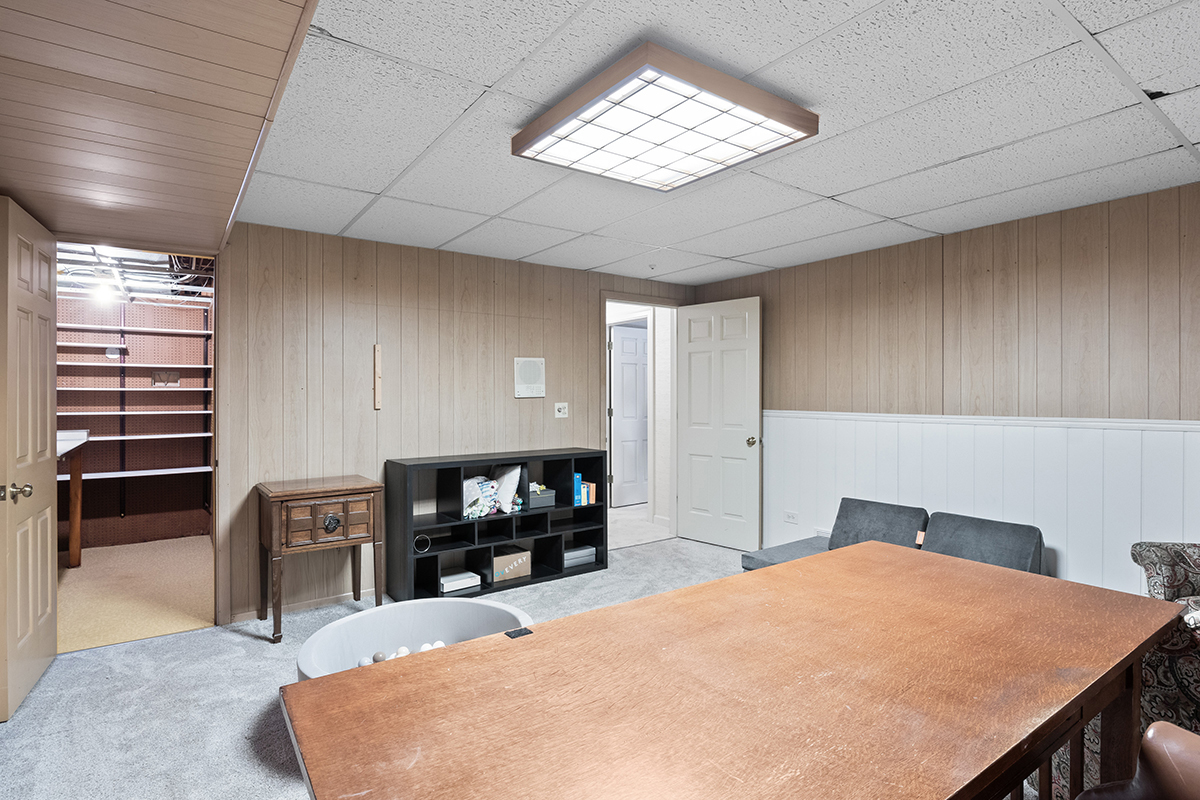 1931 Camphill Circle Inverness, IL 60067 - Photo 36 of 55 a bed room with a bed and a television