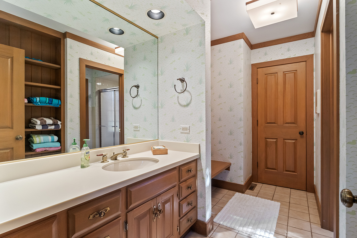 1931 Camphill Circle Inverness, IL 60067 - Photo 39 of 55 a bathroom with a sink a toilet and shower