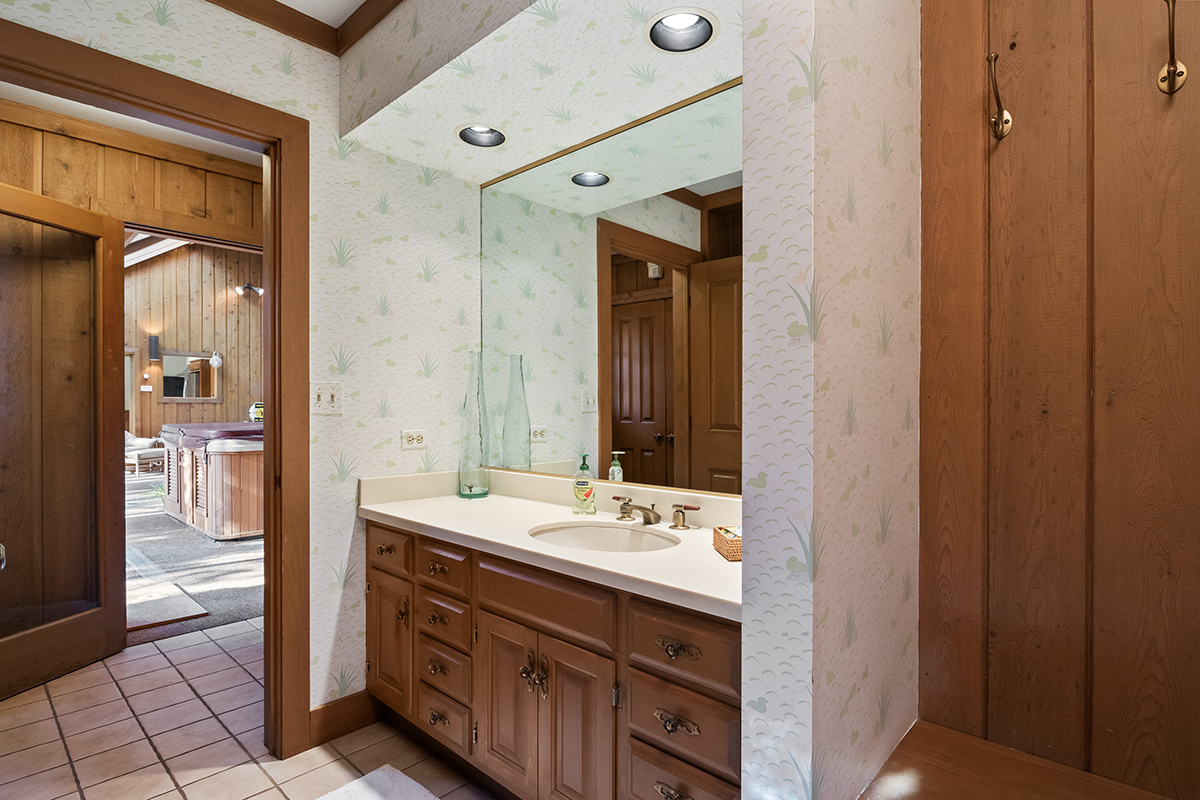 1931 Camphill Circle Inverness, IL 60067 - Photo 40 of 55 a bathroom with a sink a mirror and a shower