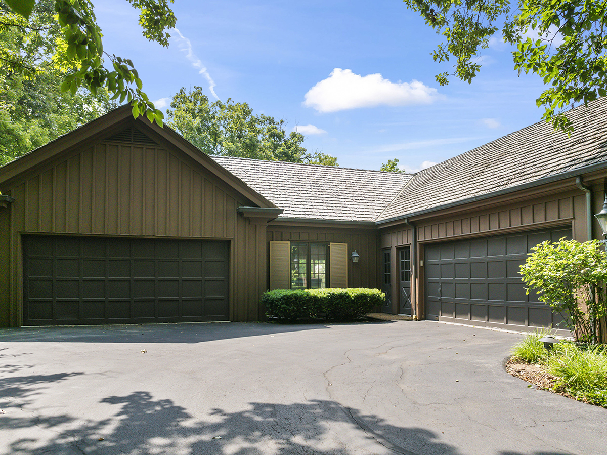 1931 Camphill Circle Inverness, IL 60067 - Photo 45 of 55 a front view of a house with a garden