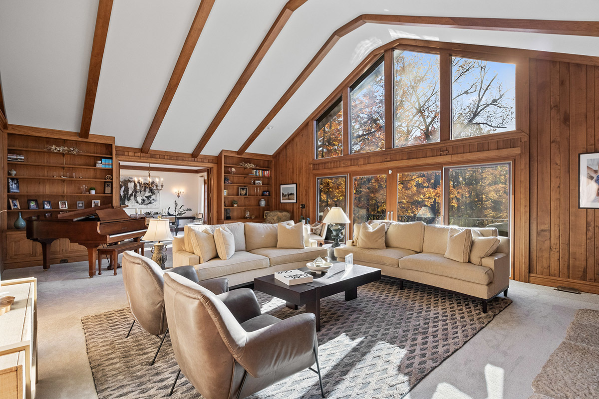 1931 Camphill Circle Inverness, IL 60067 - Photo 6 of 55 a living room with furniture a fireplace and a floor to ceiling window