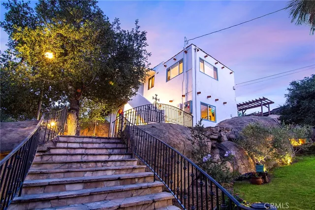 a view of a backyard with plants and a patio