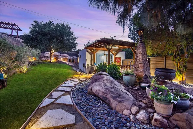 a view of a roof deck with wooden floor and barbeque oven