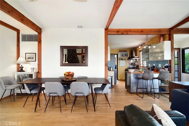 a view of a balcony with wooden floor and a mountain view