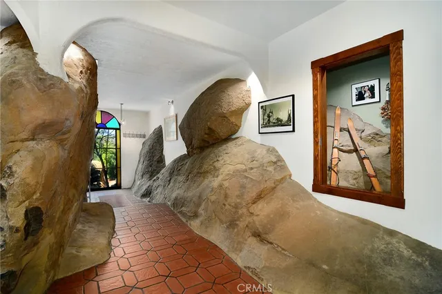 a view of a balcony with wooden floor and fence