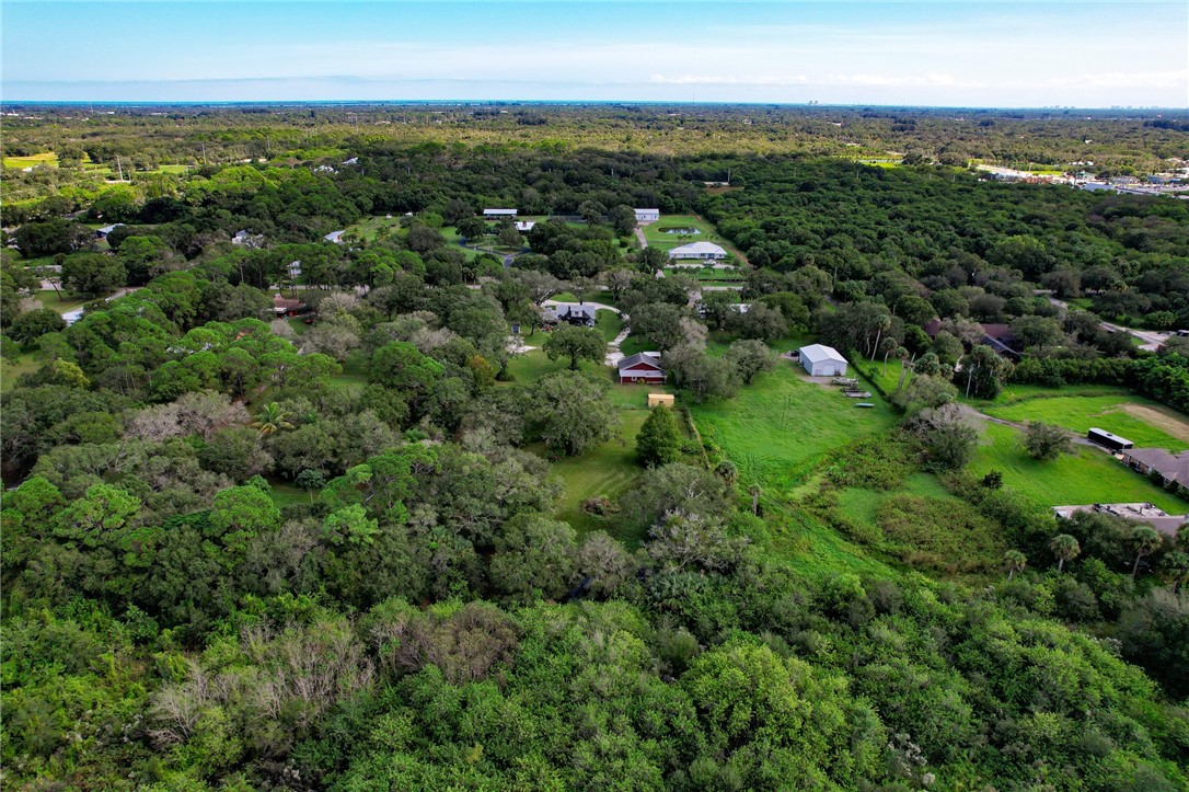 4761 Jorgensen Road Fort Pierce, FL 34981 - Photo 14 of 26 an aerial view of residential houses with outdoor and green space