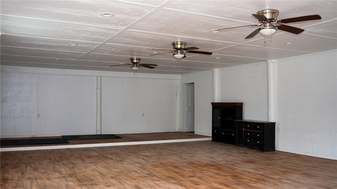4761 Jorgensen Road Fort Pierce, FL 34981 - Photo 16 of 26 a view of room with a flat screen tv and ceiling fan