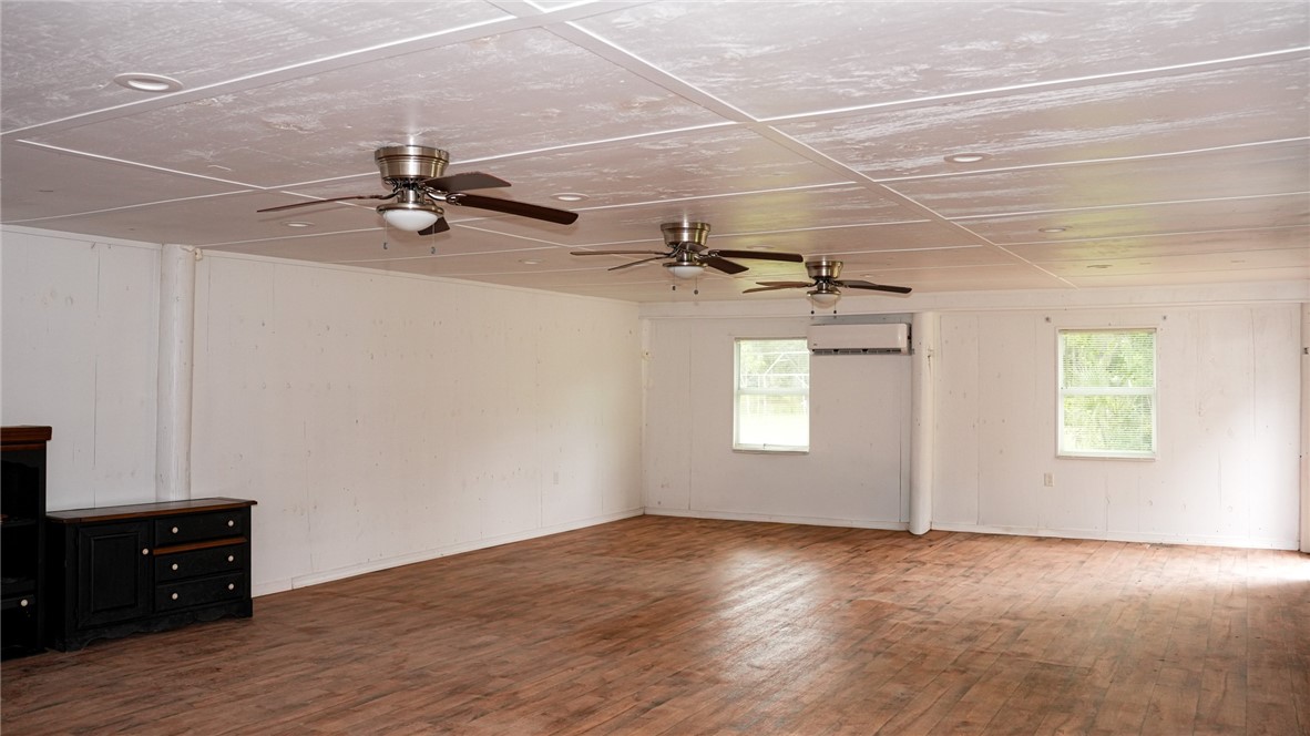 4761 Jorgensen Road Fort Pierce, FL 34981 - Photo 18 of 26 an empty room with windows and fan