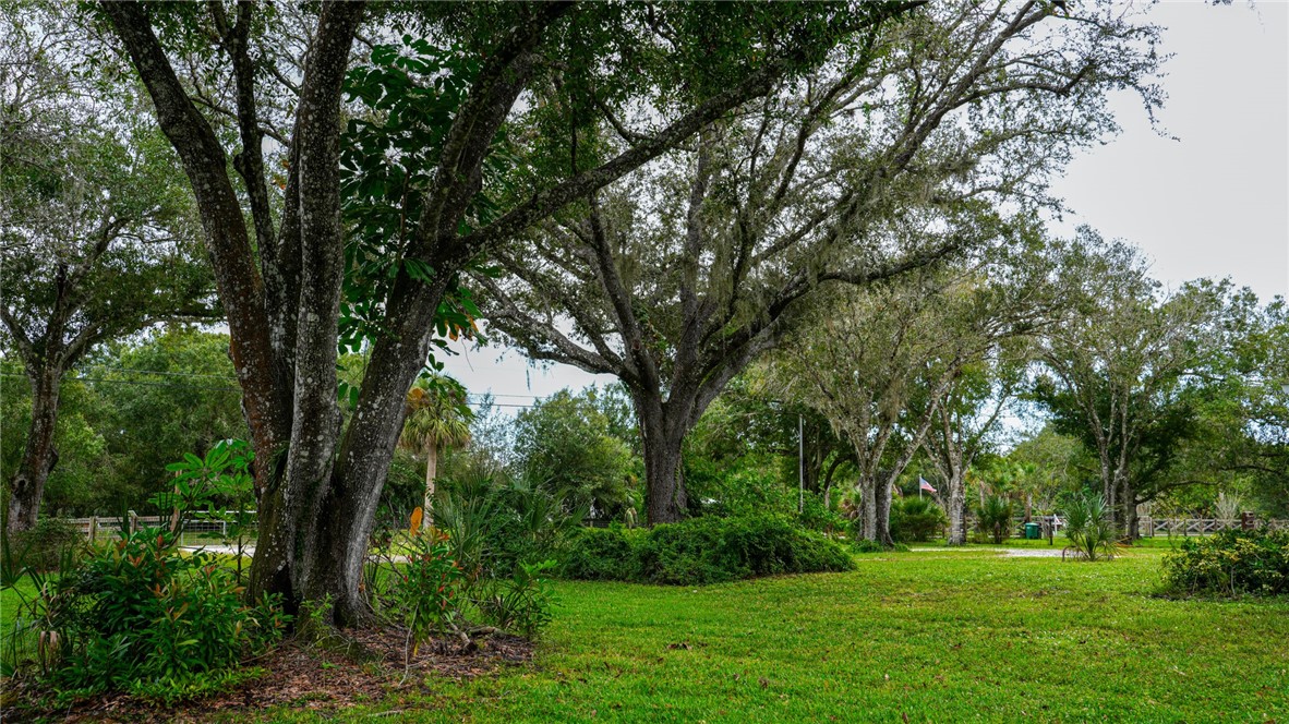 4761 Jorgensen Road Fort Pierce, FL 34981 - Photo 19 of 26 a backyard of a house with lots of green space