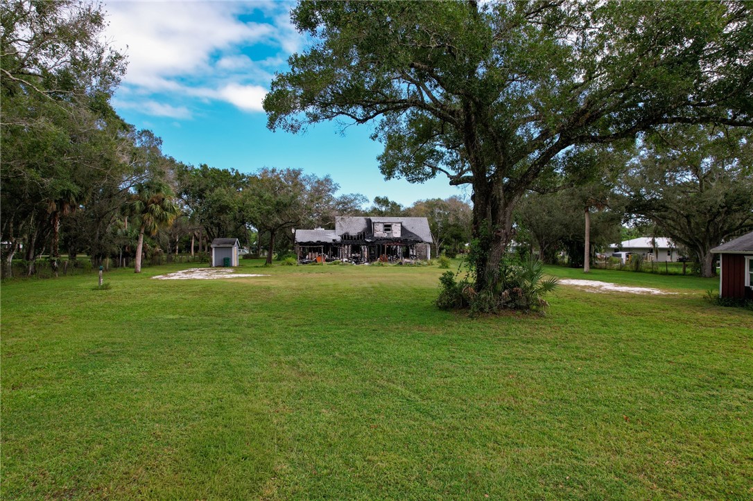 4761 Jorgensen Road Fort Pierce, FL 34981 - Photo 22 of 26 a view of a park with large trees