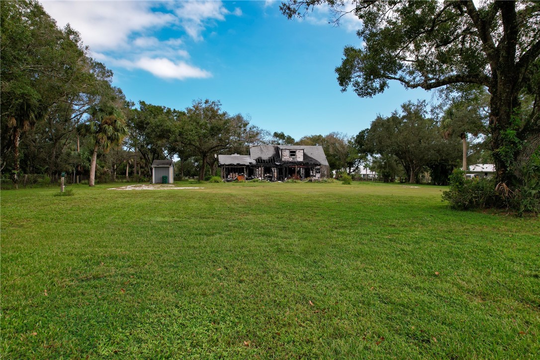 4761 Jorgensen Road Fort Pierce, FL 34981 - Photo 25 of 26 a view of a park with large trees