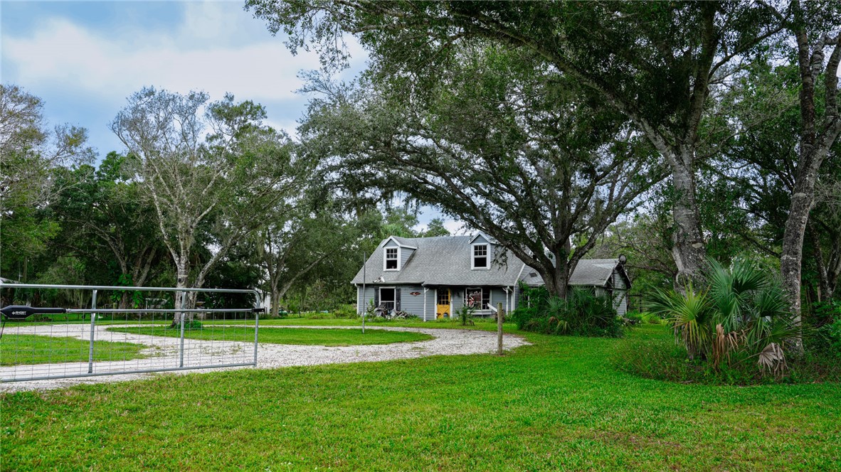 4761 Jorgensen Road Fort Pierce, FL 34981 - Photo 3 of 26 a view of a house with a big yard