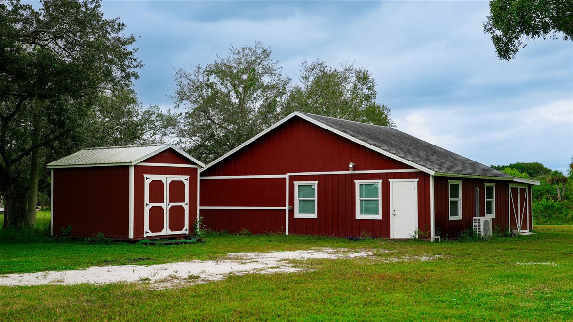 4761 Jorgensen Road Fort Pierce, FL 34981 - Photo 4 of 26 a front view of a house with a garden