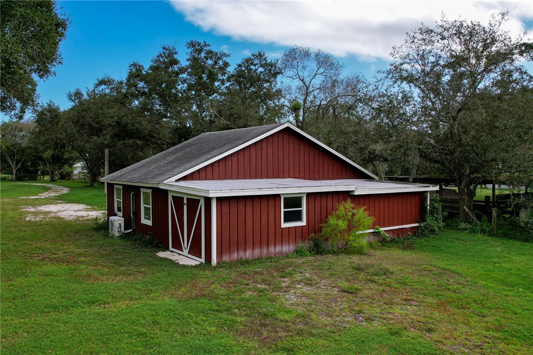 4761 Jorgensen Road Fort Pierce, FL 34981 - Photo 6 of 26 a view of a house with backyard and garden