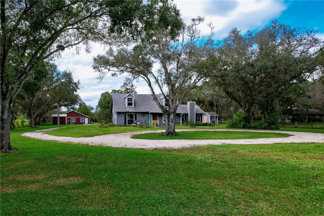4761 Jorgensen Road Fort Pierce, FL 34981 - Photo 8 of 26 a house view with a garden space