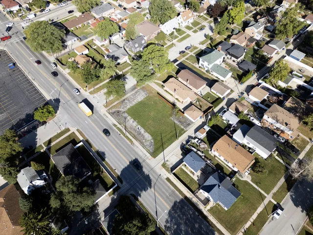 an aerial view of a residential building with an outdoor space