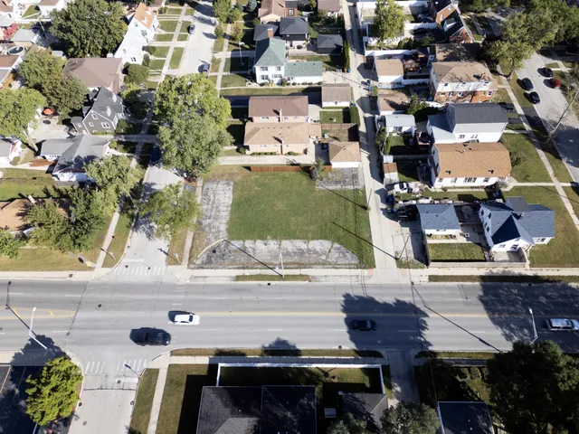 an aerial view of residential houses with outdoor space