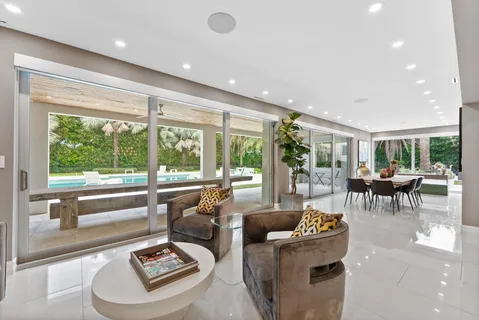 a kitchen with stainless steel appliances granite countertop a sink and a white cabinets