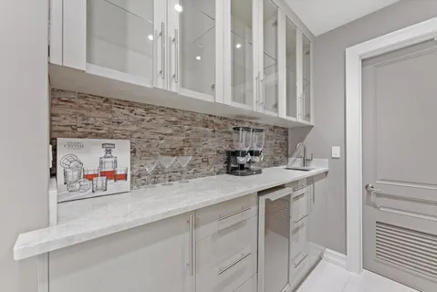 a spacious bathroom with a sink a large mirror and shower