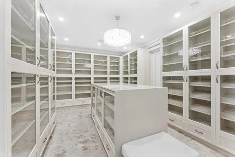 a view of a room with wooden floor and cabinet