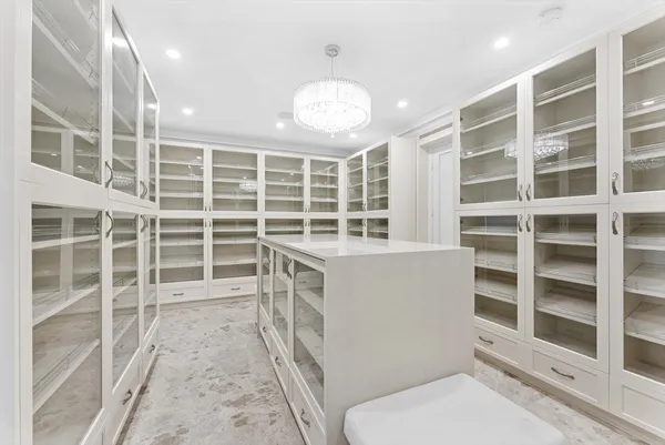a view of a room with wooden floor and cabinet