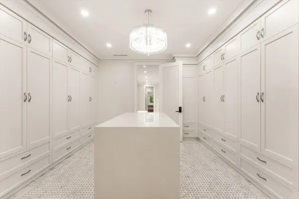 a spacious bathroom with a granite countertop sink mirror and a bathtub