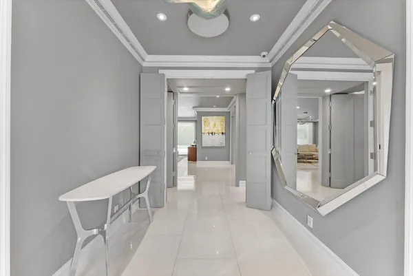 a view of a dining room with furniture and a chandelier
