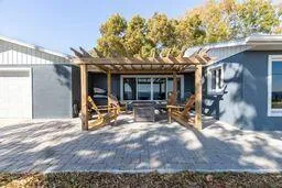 a kitchen with stainless steel appliances granite countertop a stove a sink a microwave and wooden cabinets