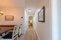 a kitchen with stainless steel appliances granite countertop a sink a stove and a wooden floors