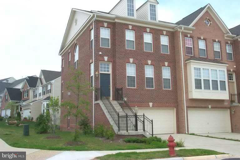 a front view of a building with garden