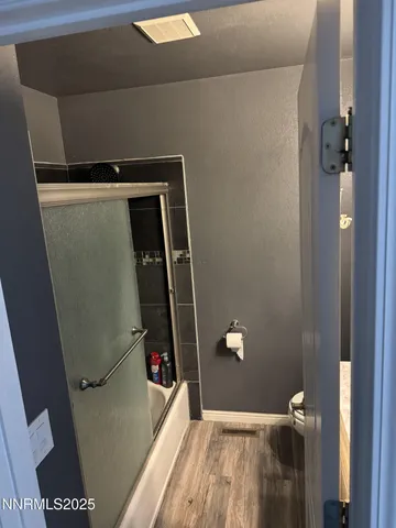 a bedroom with a bed and a walk in closet