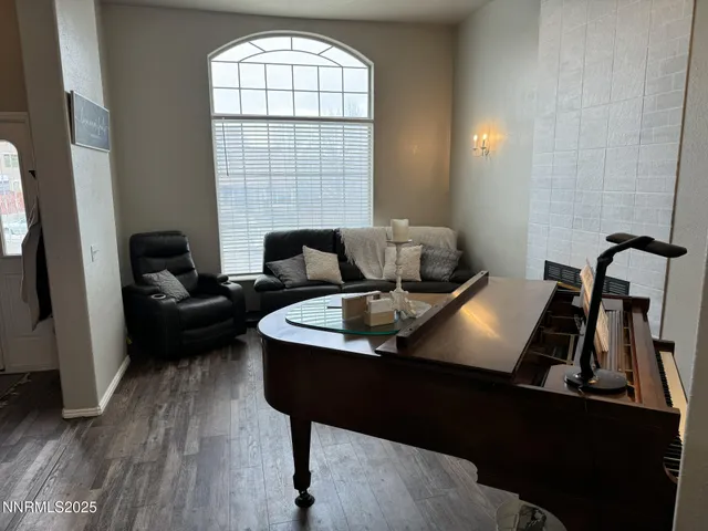 a living room with furniture and a window