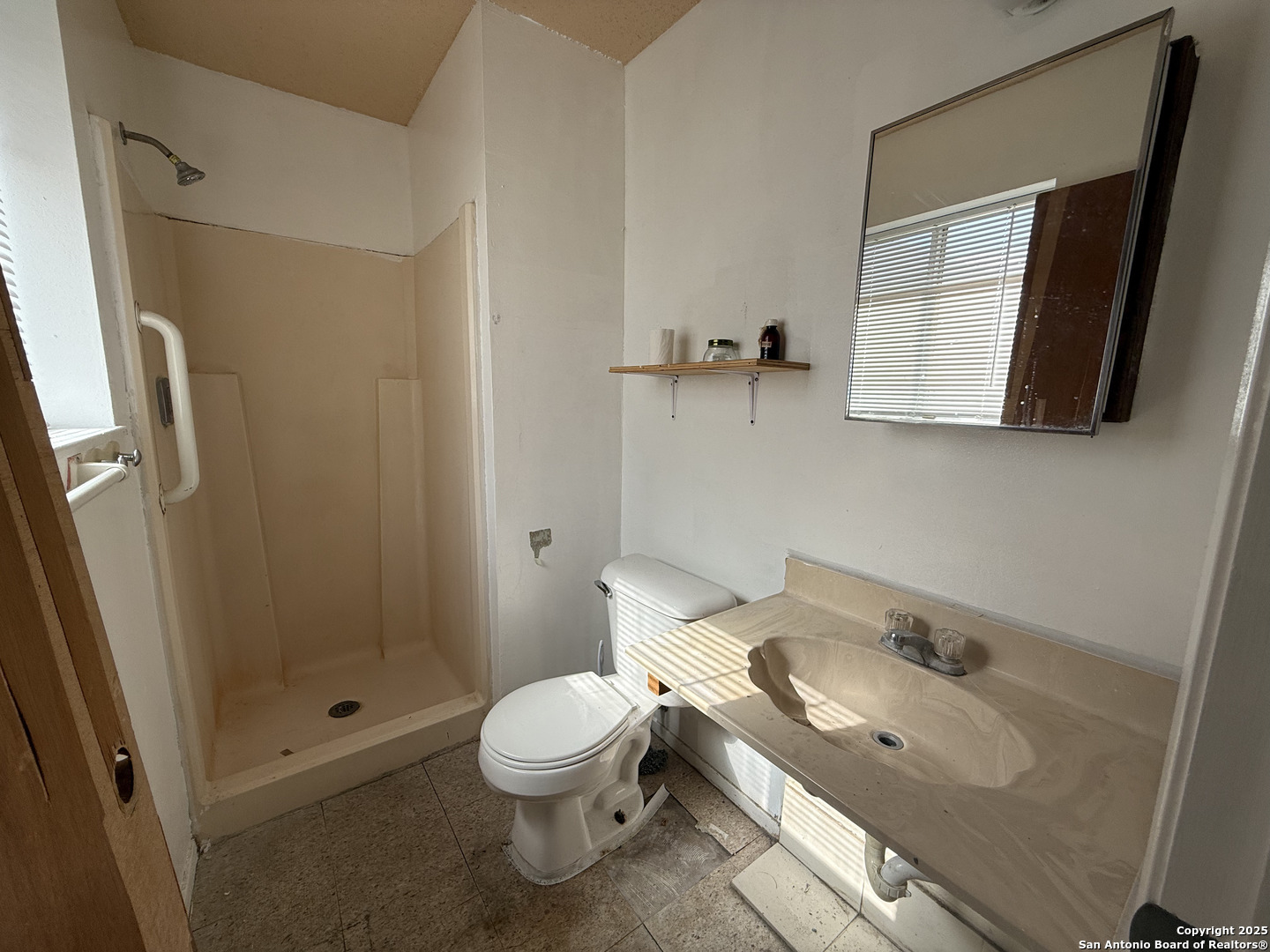 813 Ross Street Kerrville, TX 78028 - Photo 7 of 12 a bathroom with a sink and a toilet