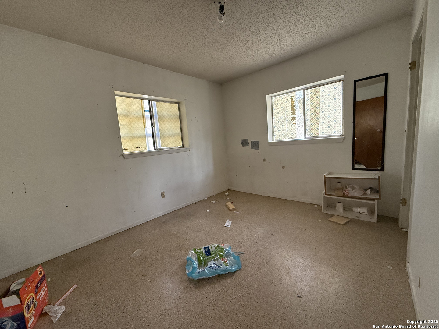 813 Ross Street Kerrville, TX 78028 - Photo 8 of 12 a living room with furniture and a flat screen tv