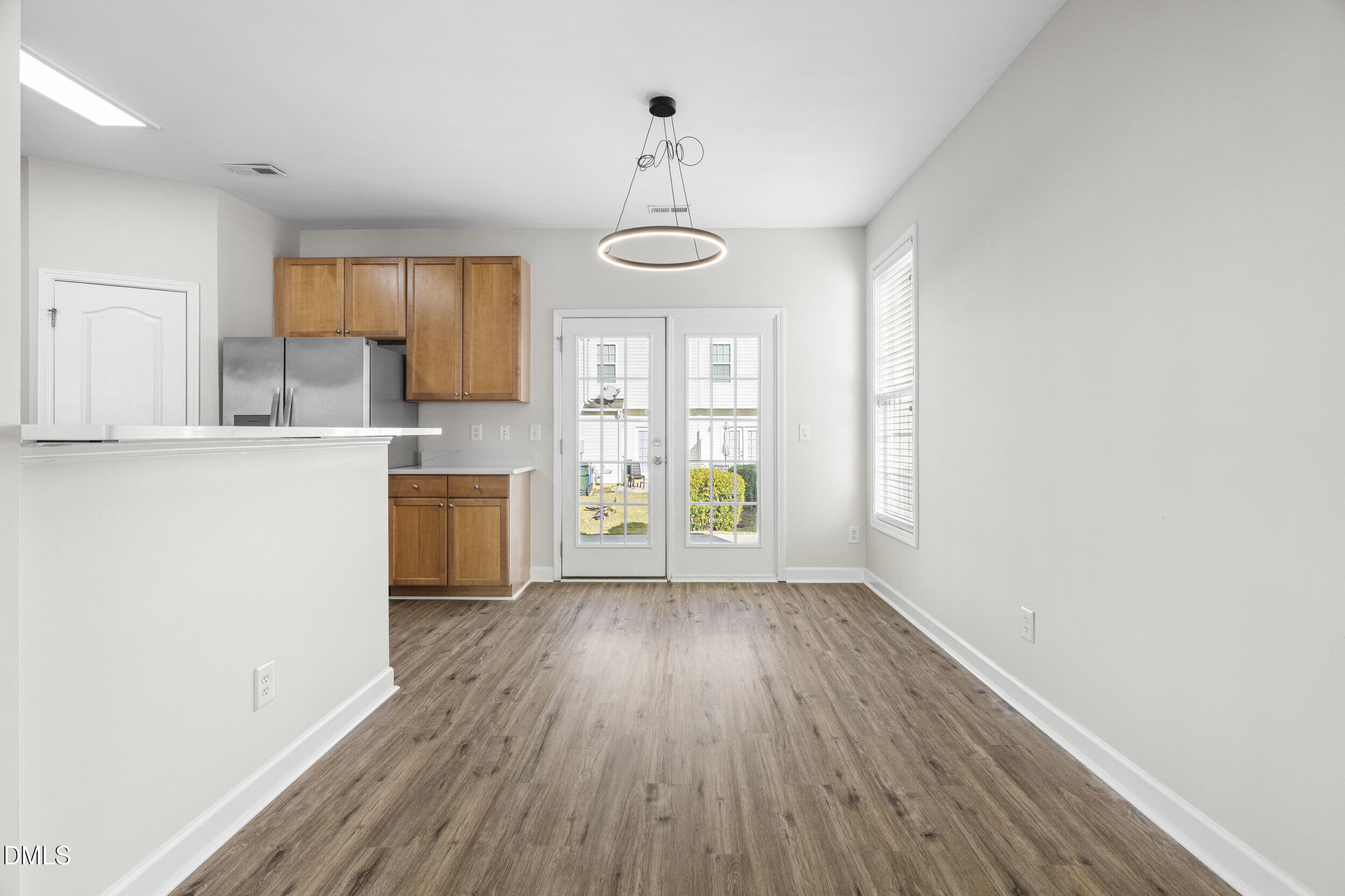 8320 Boca Point Raleigh, NC 27616 - Photo 11 of 28 a view of a kitchen with wooden floor and electronic appliances