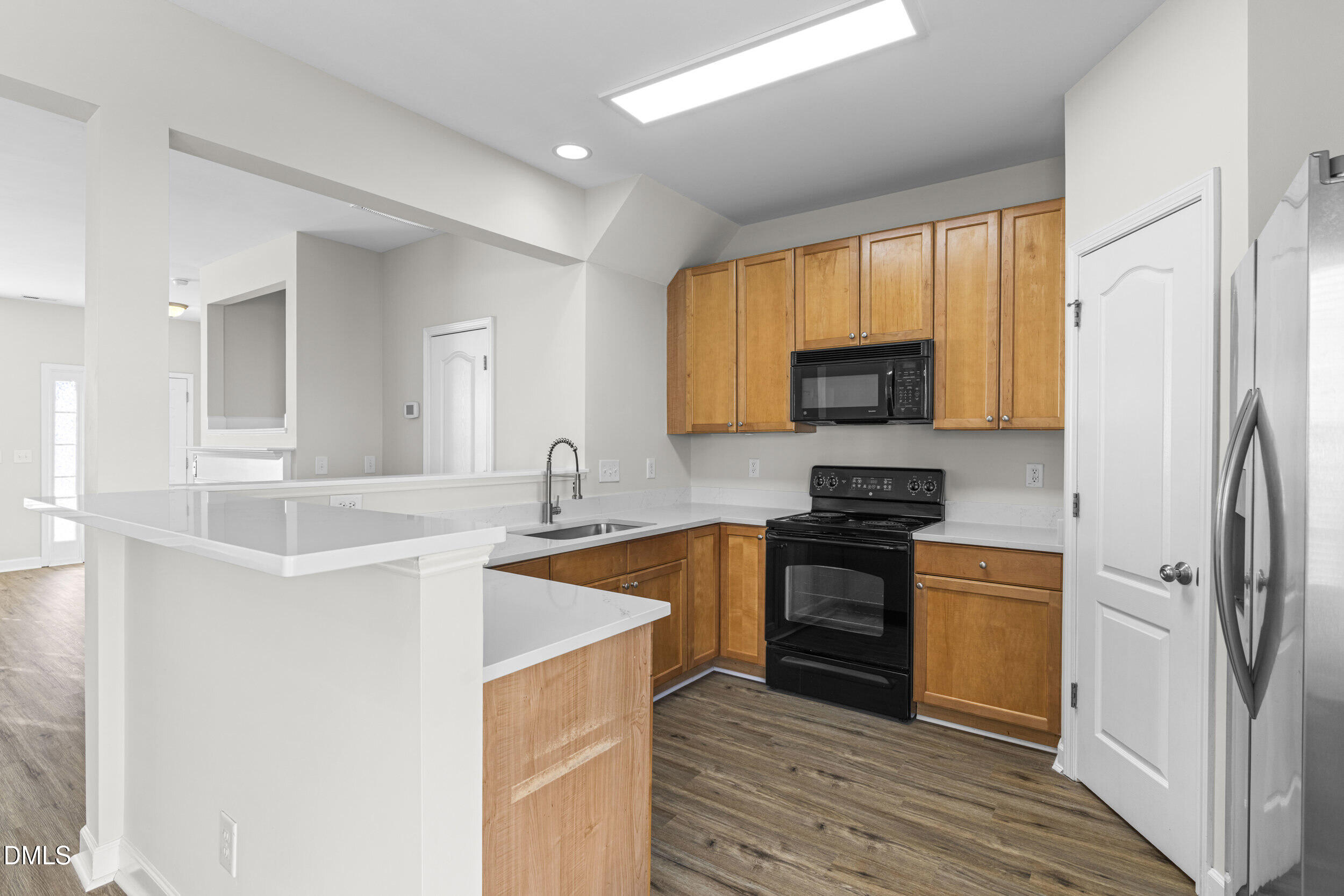 8320 Boca Point Raleigh, NC 27616 - Photo 14 of 28 a kitchen with stainless steel appliances granite countertop a stove a sink and a refrigerator