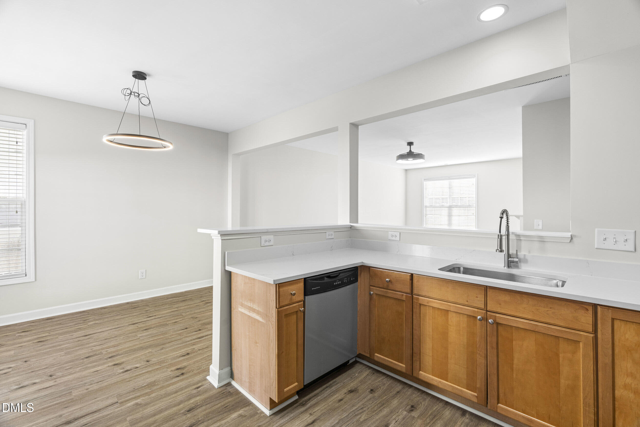 8320 Boca Point Raleigh, NC 27616 - Photo 17 of 28 a kitchen with a sink cabinets and wooden floor