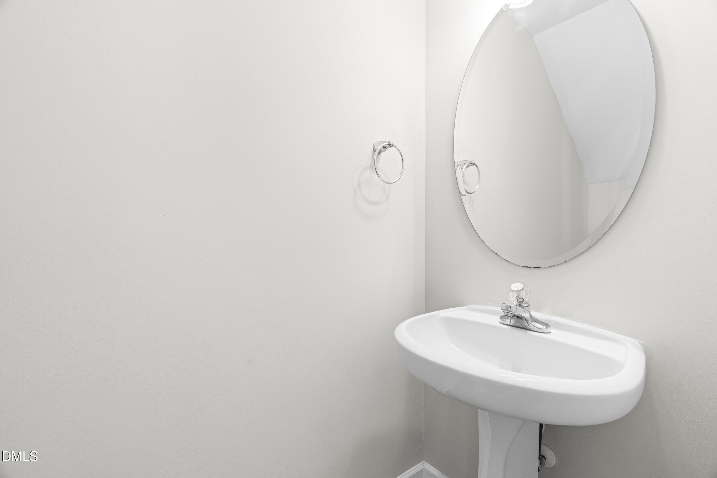 8320 Boca Point Raleigh, NC 27616 - Photo 18 of 28 a bathroom with a sink a mirror and a toilet