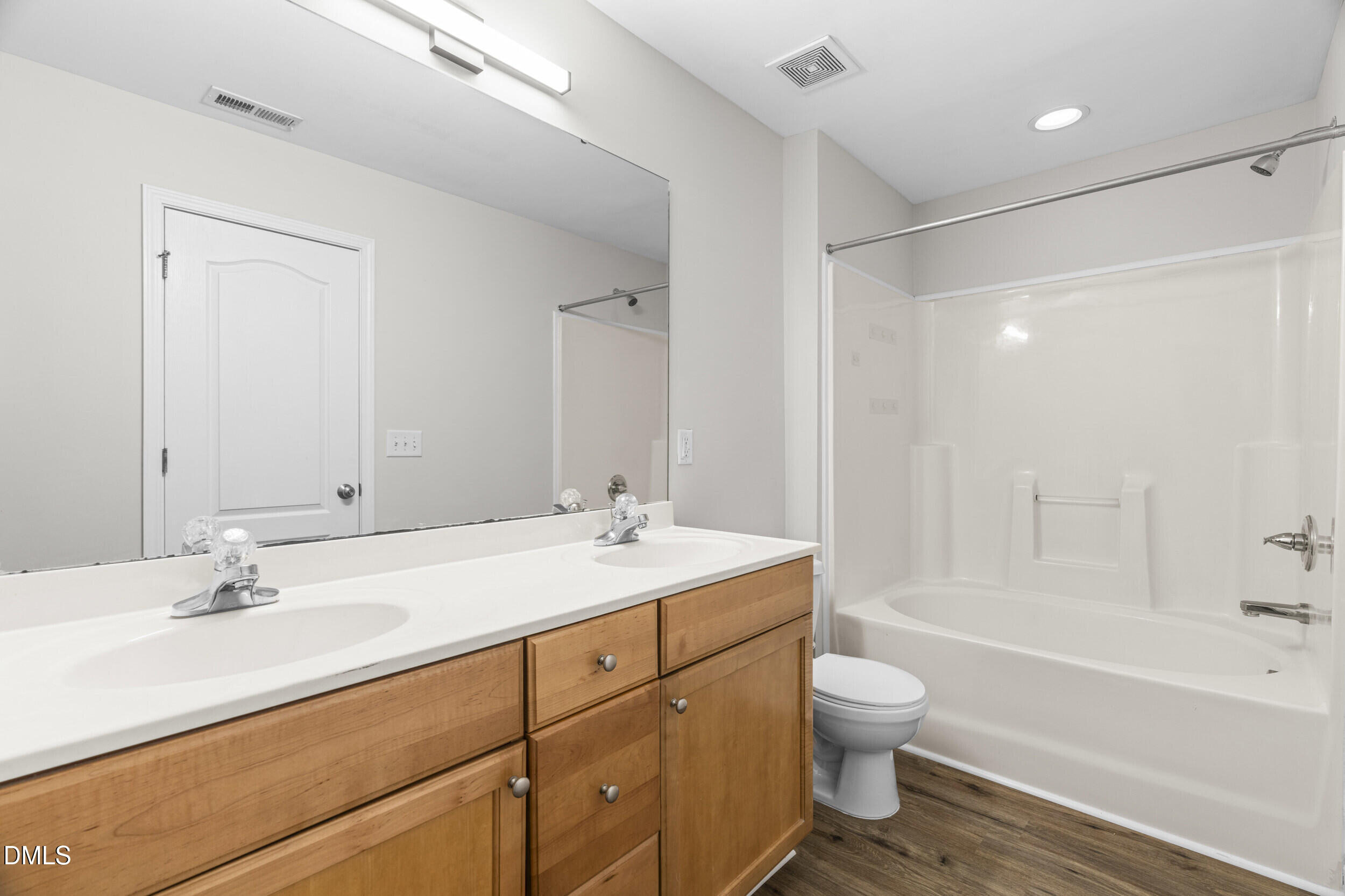 8320 Boca Point Raleigh, NC 27616 - Photo 22 of 28 a bathroom with a granite countertop sink a toilet and a bathtub