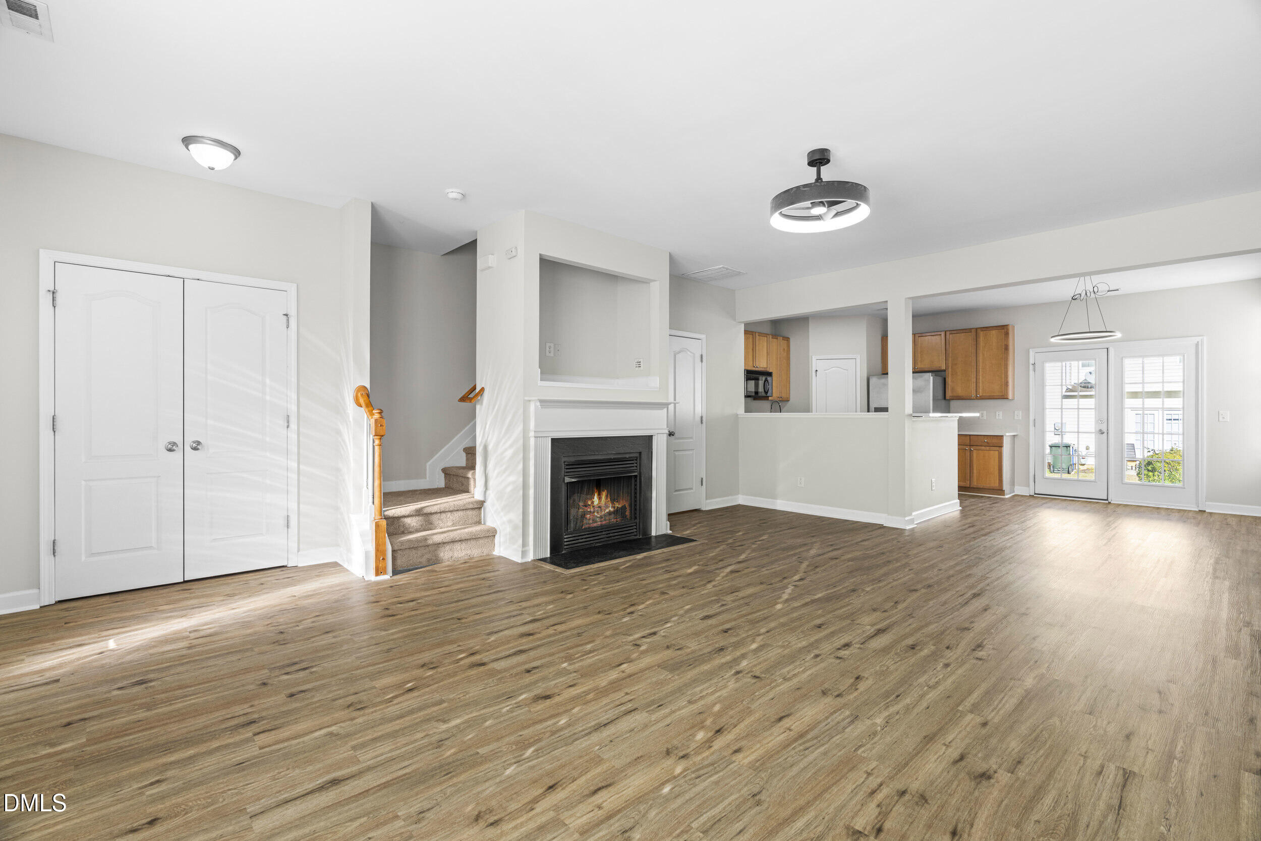 8320 Boca Point Raleigh, NC 27616 - Photo 7 of 28 a view of a livingroom with wooden floor and a fireplace