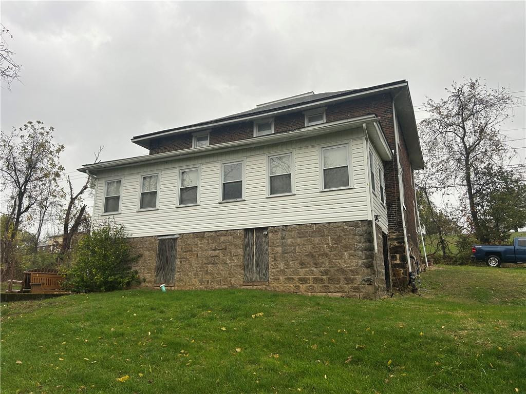 3022 Richey Road Connellsville, PA 15425 - Photo 3 of 18 a front view of a house with a garden