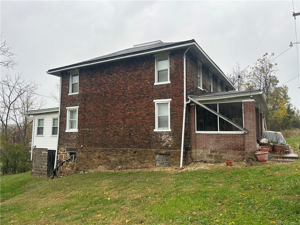 3022 Richey Road Connellsville, PA 15425 - Photo 4 of 18 a front view of a house with a yard