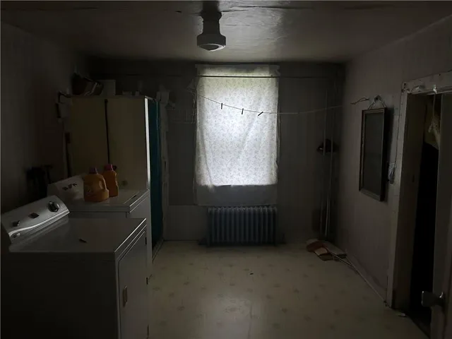 a room with black door and a window