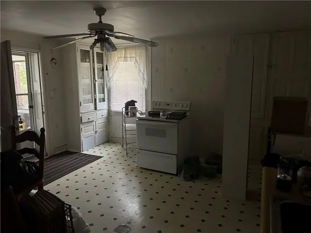 a kitchen with a sink and a refrigerator