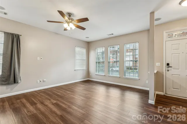 a view of livingroom with hardwood floor and ceiling fan